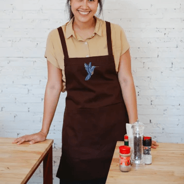 Design embroidered on a apron qikink