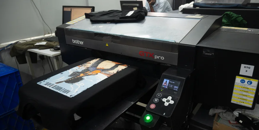 dtg printing machine in action at qikink fulfilment centre